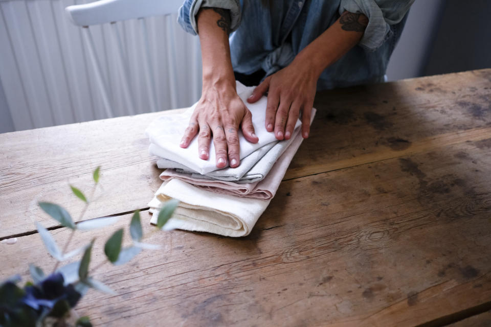 woman folding cloth napkins