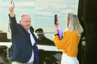 New LSU football coach Brian Kelly gestures to fans after his arrival at Baton Rouge Metropolitan Airport, Tuesday, Nov. 30, 2021, in Baton Rouge, La. Kelly, formerly of Notre Dame, is said to have agreed to a 10-year contract with LSU worth $95 million plus incentives. (AP Photo/Matthew Hinton)