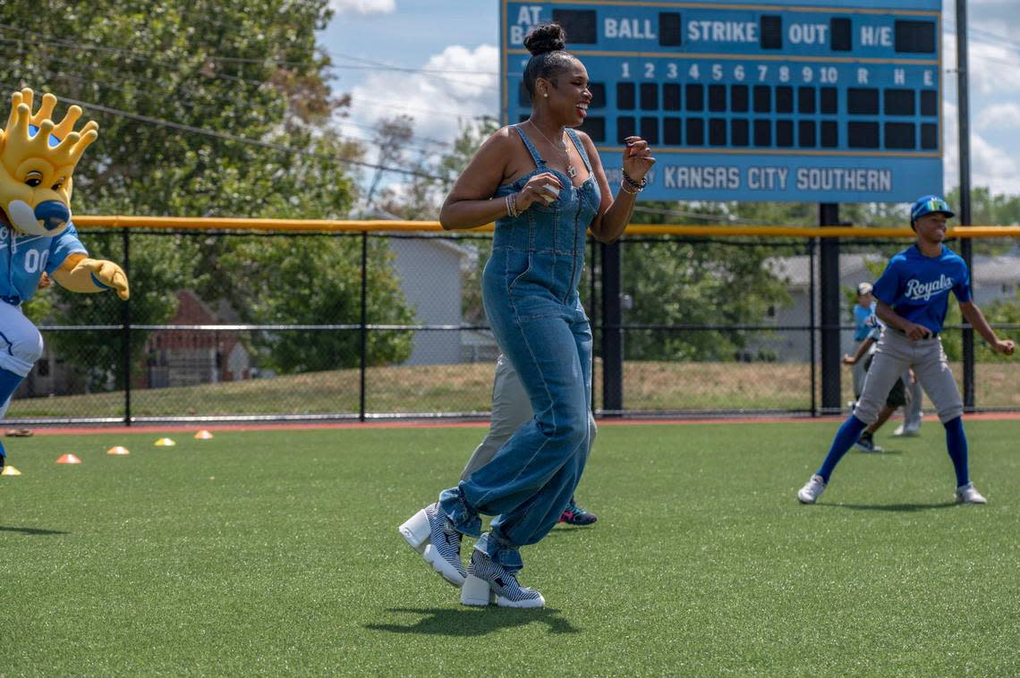 Jennifer Hudson goes through warm-up exercises with members of the Boys & Girls Clubs of Greater Kansas City during her visit to the MLB Urban Youth Academy on Tuesday.