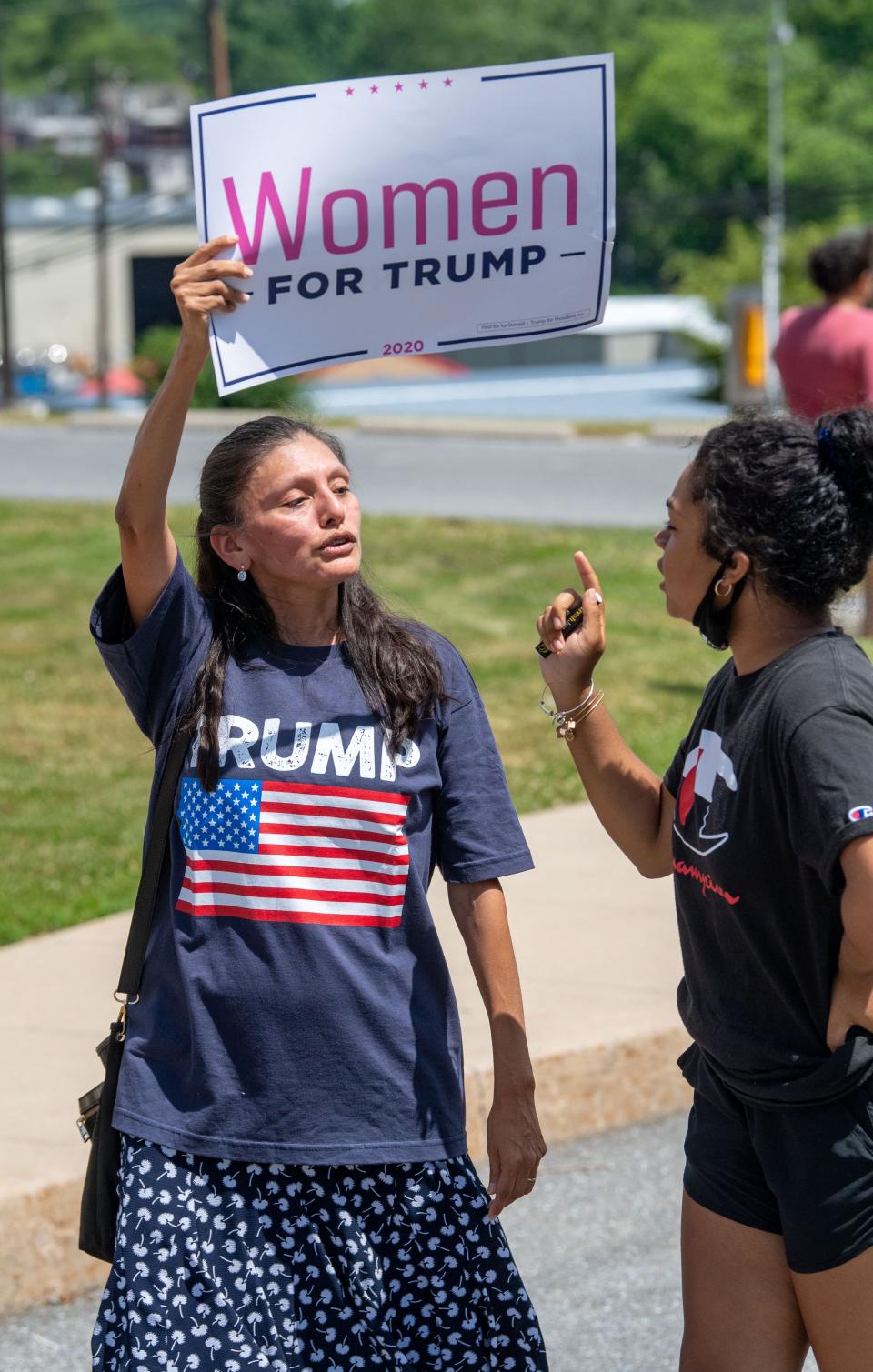 Black Lives Matter supporters and Trump supporters debate issues in front of the Lancaster Recreation Center, where former Vice President Joe Biden is visiting Pennsylvania families, June 25, 2020.