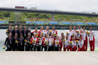 Gold medalists team Canada, center, silver medalist team New Zealand, left, and bronze medalists team Austria pose during the medal ceremony for the women's rowing single sculls final at the 2020 Summer Olympics, Friday, July 30, 2021, in Tokyo, Japan. (AP Photo/Lee Jin-man)