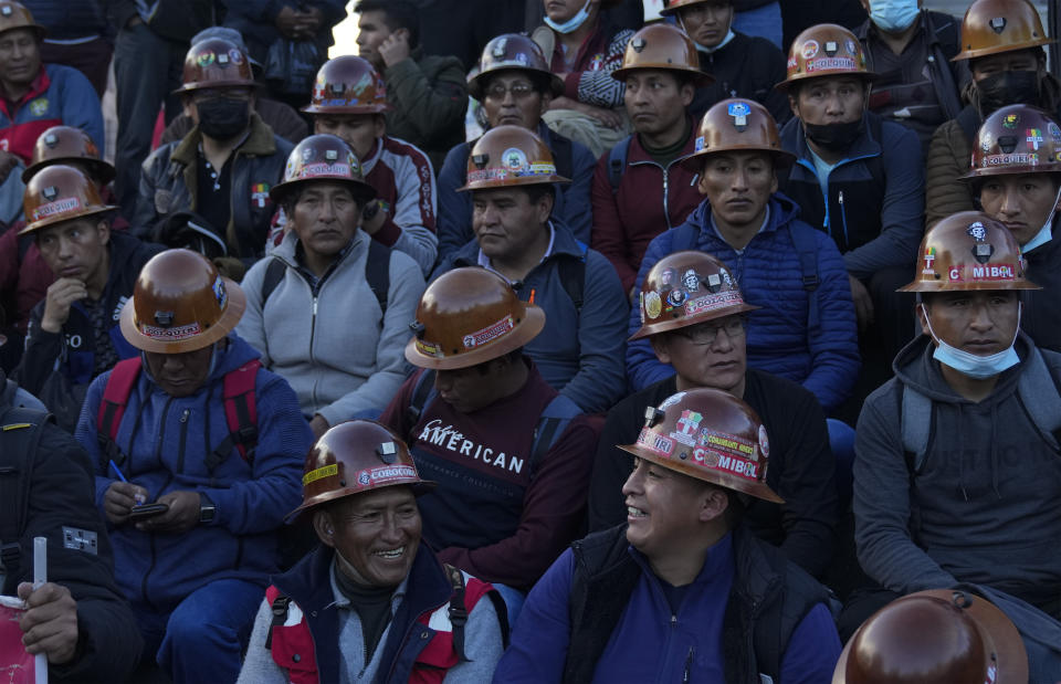 Miners rest after a protest against jailed opposition leader and governor of Santa Cruz region, Luis Fernando Camacho, in La Paz, Bolivia, Thursday, Jan. 12, 2023. Prosecutors on Dec. 29 remanded Camacho into custody for four months while he faces terrorism charges. (AP Photo/Juan Karita)