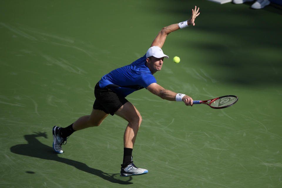 Kevin Anderson, of South Africa, chases the ball during a match in the Citi Open tennis tournament against Jenson Brooksby, Monday, Aug. 2, 2021, in Washington. (AP Photo/Nick Wass)