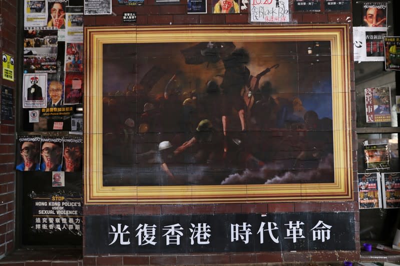 Artwork and posters are seen on a wall in Hong Kong Polytechnic University (PolyU)