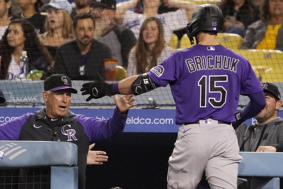 Colorado Rockies' Randal Grichuk, right, is congratulated by manager Bud Black after hitting a two-run home run during the seventh inning of a baseball game Tuesday, Oct. 4, 2022, in Los Angeles. (AP Photo/Mark J. Terrill)