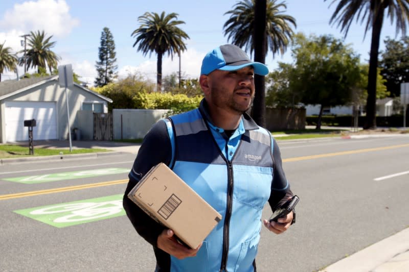 Joseph Alvarado makes a delivery for Amazon during the outbreak of the coronavirus disease