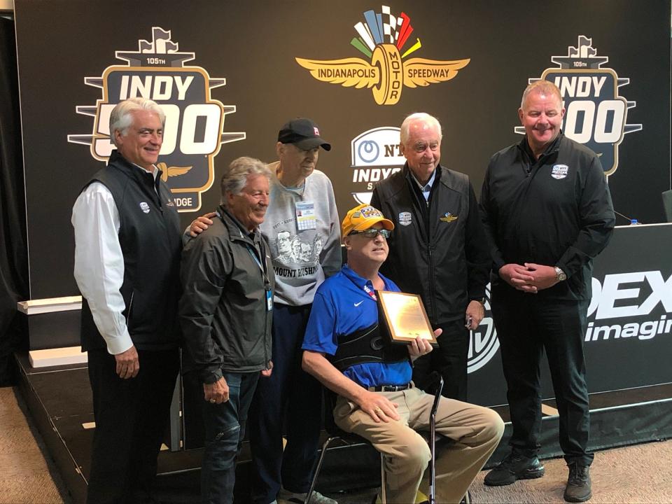 Bob Jenkins holding his Robin Miller Award on Friday, May 28. From left to right: Mark Miles, Mario Andretti, Robin Miller, Bob Jenkins, Roger Penske and Jay Frye.