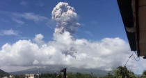 An ash cloud hovers over the Mayon volcano, as seen from the Bicol Region, Philippines, in this still image taken from a January 21,2018 social media video. Randall Matthew Lorayes via REUTERS