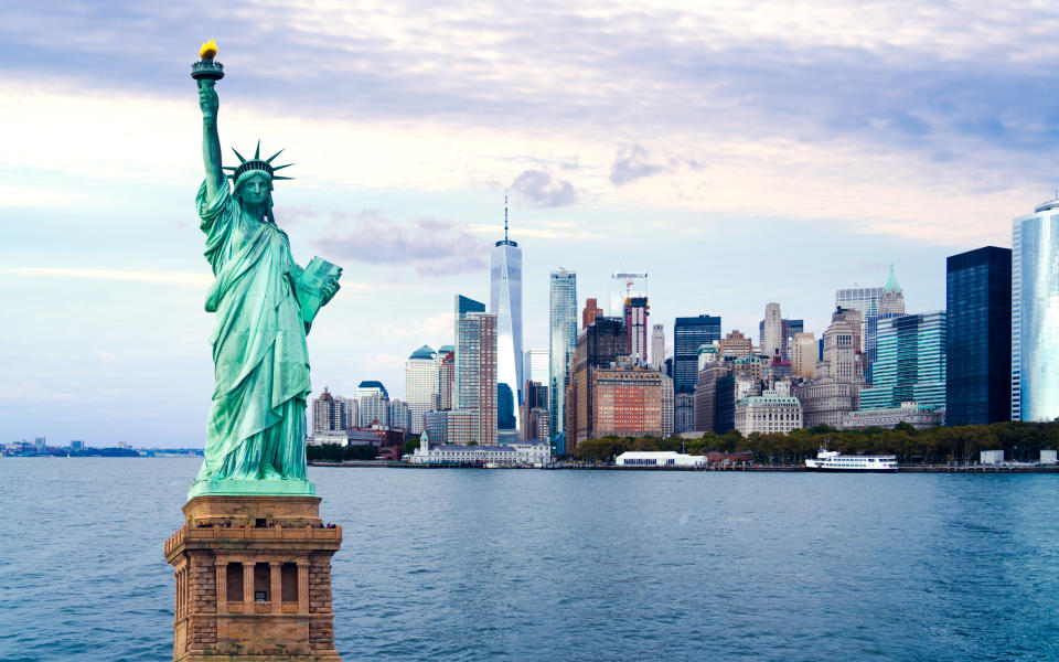 The statue of Liberty with World Trade Center background, Landmarks of New York City