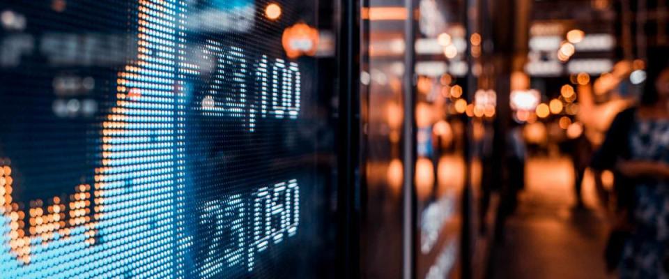 Financial stock exchange market display screen board on the street, selective focus