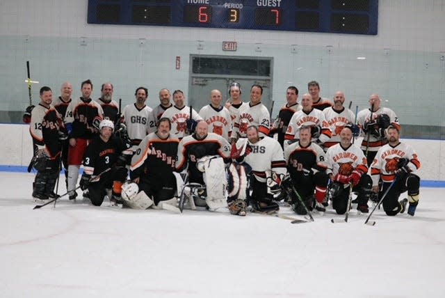 The older alumni team photo