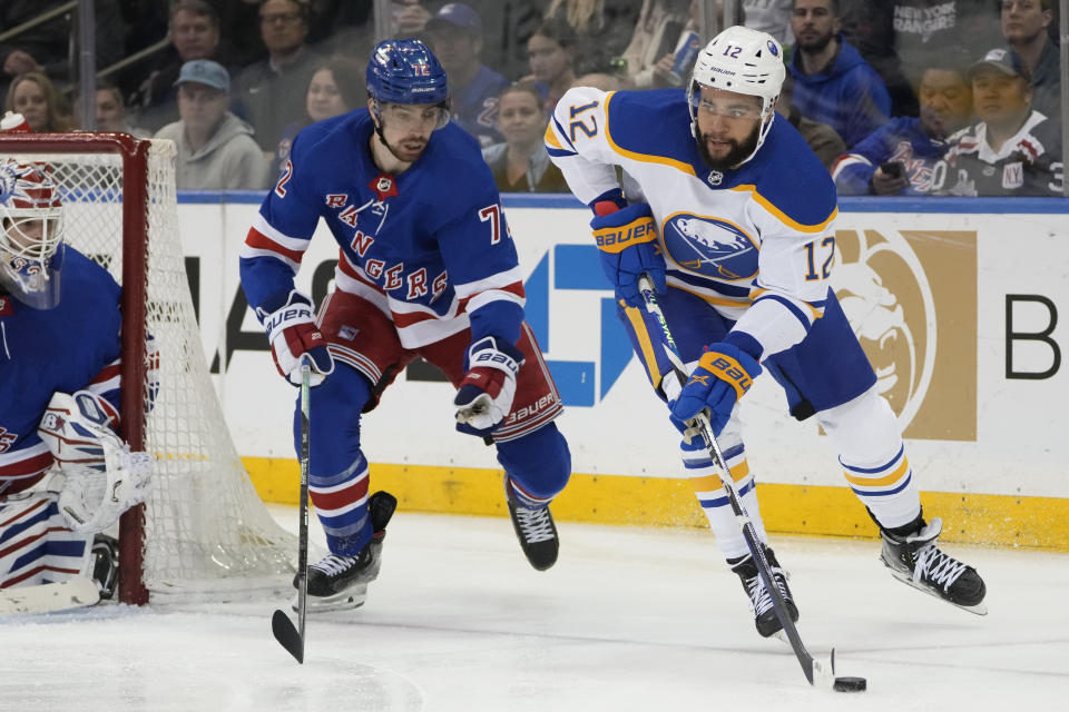 Buffalo Sabres left wing Jordan Greenway (12) looks to pass against New York Rangers center Filip Chytil (72) during the second period of an NHL hockey game, Monday, April 10, 2023, in New York. (AP Photo/John Minchillo)