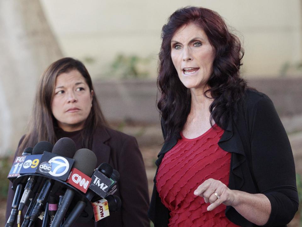 Cindy Lee Garcia, right, one of the actresses in "Innocence of Muslims," and attorney M. Cris Armenta hold a news conference before a hearing at Los Angeles Superior Court in Los Angeles, Thursday, Sept. 20, 2012. Garcia is asking a judge to issue an injunction demanding the 14-minute trailer for "Innocence of Muslims" be pulled from YouTube. (AP Photo/Jason Redmond)