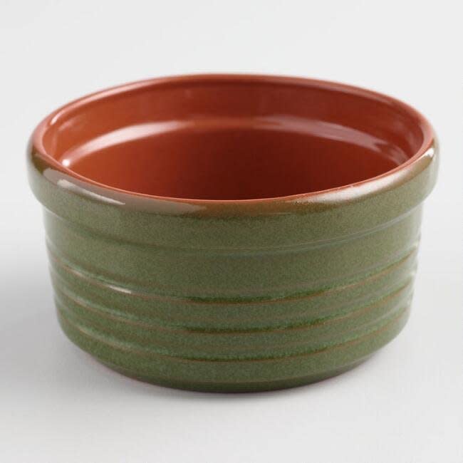 This <a href="https://www.worldmarket.com/product/green-reactive-glaze-terracotta-ramekin.do?sortby=ourPicks&amp;from=Search" target="_blank">green ramekin</a> is ideal for oven-to-table serving.