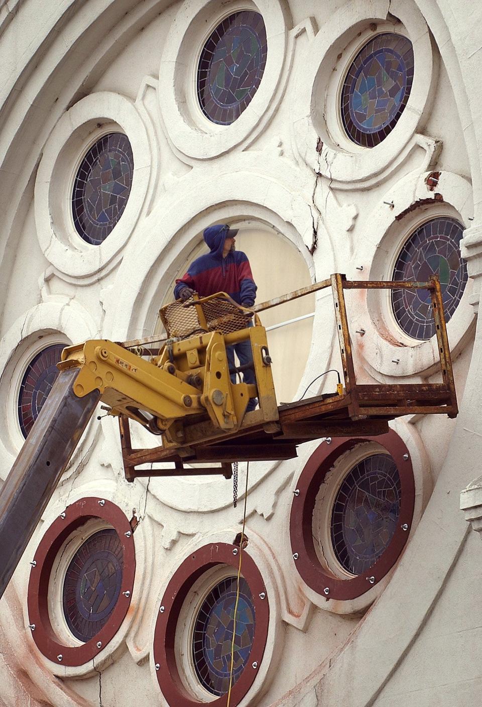 Tue 24 Feb 04  Johnny Scobey (cq) with Master Church Builders works to restore some windows on the First Baptist Beale Street Church Tuesday. The church was built shortly after the 1860's and is the oldest continous black congregation in Memphis, according to a historical marker at the site.