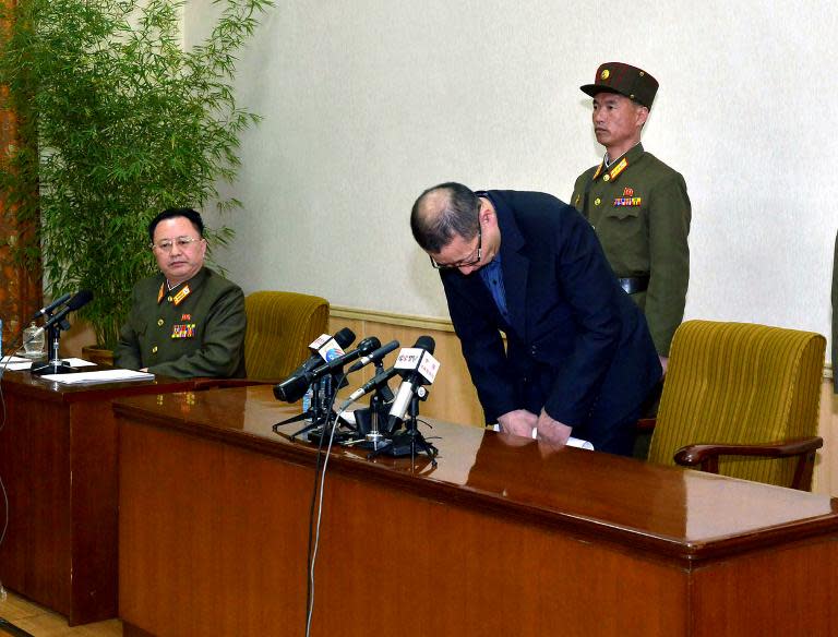 South Korean Choe Chun-Gil, arrested for alleged spying in North Korea, bows at a press conference at the People's Palace of Culture in Pyongyang, March 26, 2015