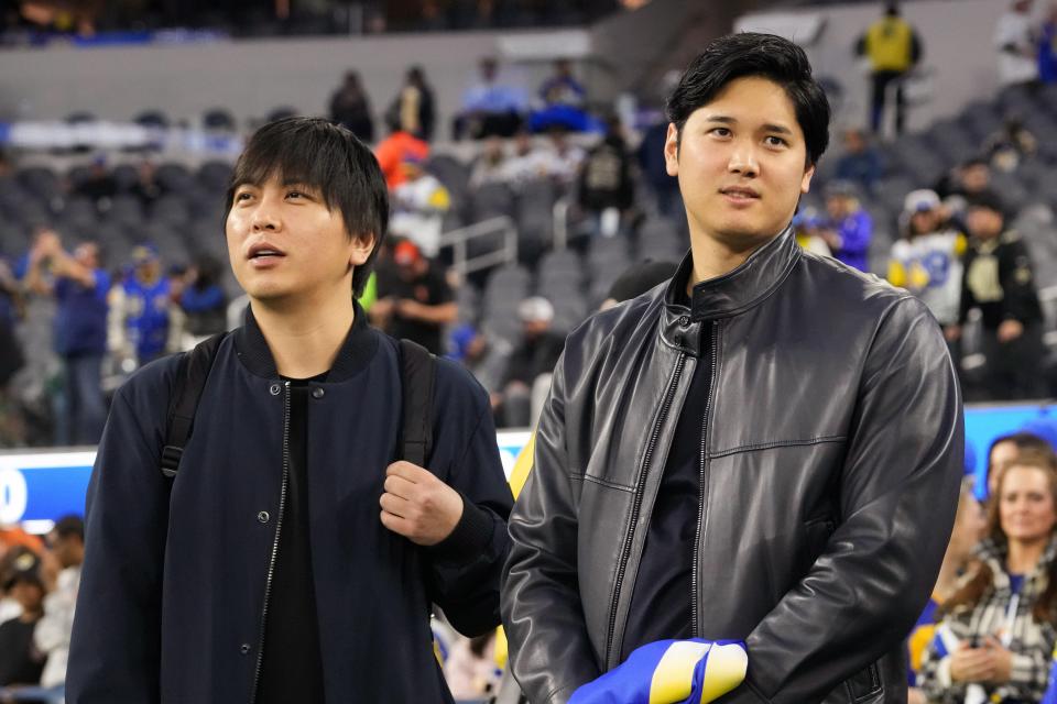 Shohei Ohtani (right) and interpreter Ippei Mizuhara attend an NFL game between the Los Angeles Rams and New Orleans Saints at SoFi Stadium on Dec. 21, 2023.
