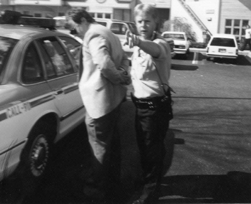 Pensacola police officer B.E. Ski Jablonski handcuffs Michael Griffin after he shot and killed Dr. David Gunn on March 10, 1993.