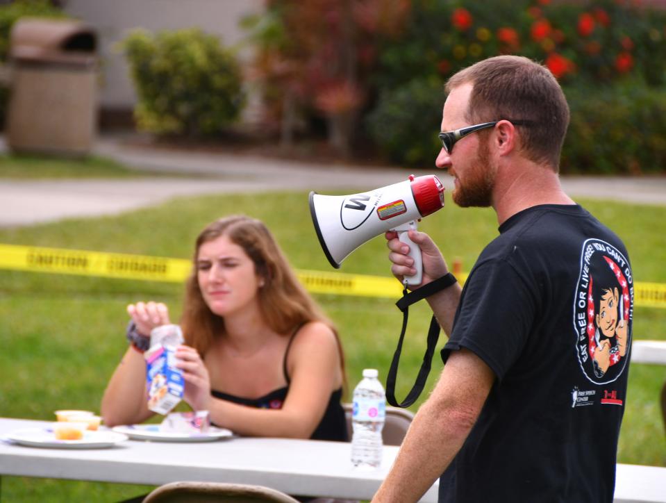 Every year, Florida Tech professor Ted Petersen presents 'the Live free or eat free' on the Crawford Building lawn. Students got to experience life without the First Amendment. They got a free lunch in exchange for signing away their First Amendment rights. Petersen, with bullhorn in hand, would tell the students where to sit, no phones, no talking, basically doing whatever he demanded and those who disobeyed were put in jail.
(Photo: MALCOLM DENEMARK/FLORIDA TODAY)