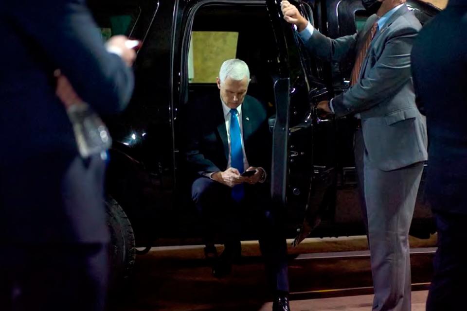 In this image released in the final report by the House select committee investigating the Jan. 6 attack on the U.S. Capitol, Vice President Mike Pence looks at a mobile device from a secured loading dock at the U.S. Capitol on Jan. 6, 2021.