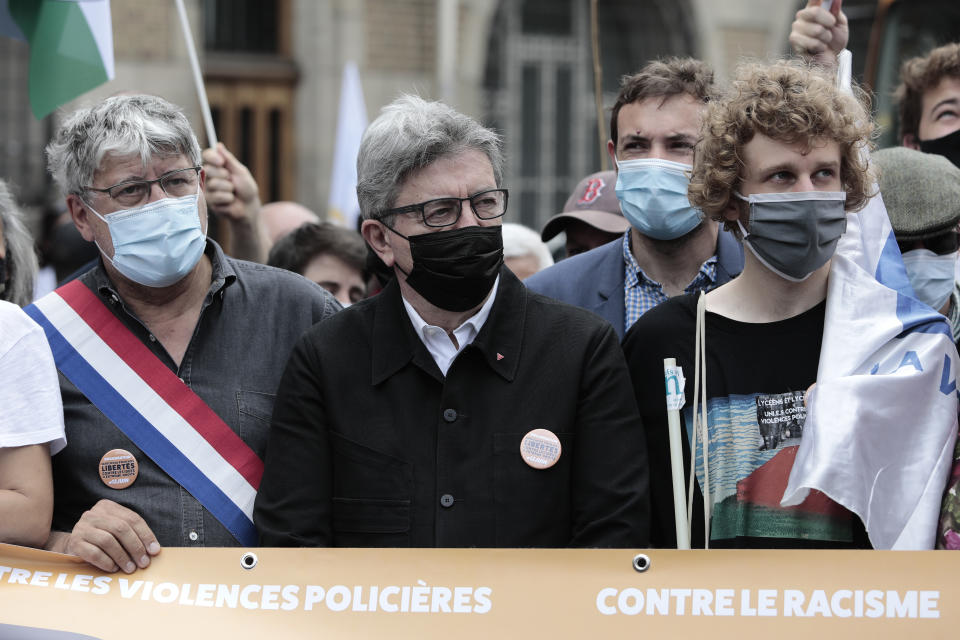 President of the French leftist "La France Insoumise" party Jean-Luc Melenchon, center, attends a demonstration, Saturday, June 12, 2021 in Paris. Thousands of people rallied throughout France Saturday to protest against the far-right. (AP Photo/Lewis Joly)