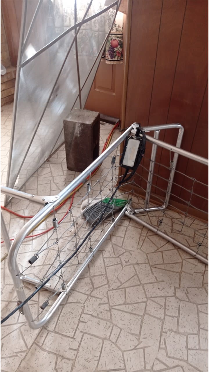 Debris left behind by a squatter in Yudith Matthews and Abram Mendez's home