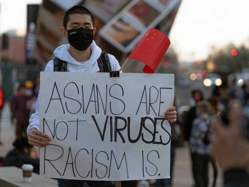 A demonstrator participates at a rally "Love Our Communities: Build Collective Power" to raise awareness of anti-Asian violence outside the Japanese American National Museum in Little Tokyo in Los Angeles on Saturday, March 13, 2021.