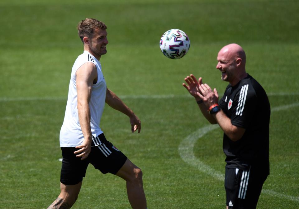 Aaron Ramey (left) with Wales interim manager Robert Page during a training session in Baku (PA Wire)