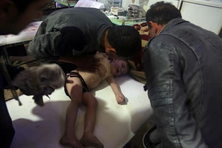A child is treated in a hospital in Douma, eastern Ghouta in Syria, after what a Syria medical relief group claims was a suspected chemical attack April, 7, 2018. White Helmets/Handout via REUTERS