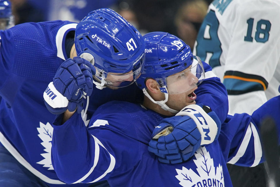 Toronto Maple Leafs forward Jason Spezza (19) celebrates his goal against the San Jose Sharks with forward Pierre Engvall (47) during the second period of an NHL hockey game Friday, Oct. 22, 2021, in Toronto. (Evan Buhler/The Canadian Press via AP)