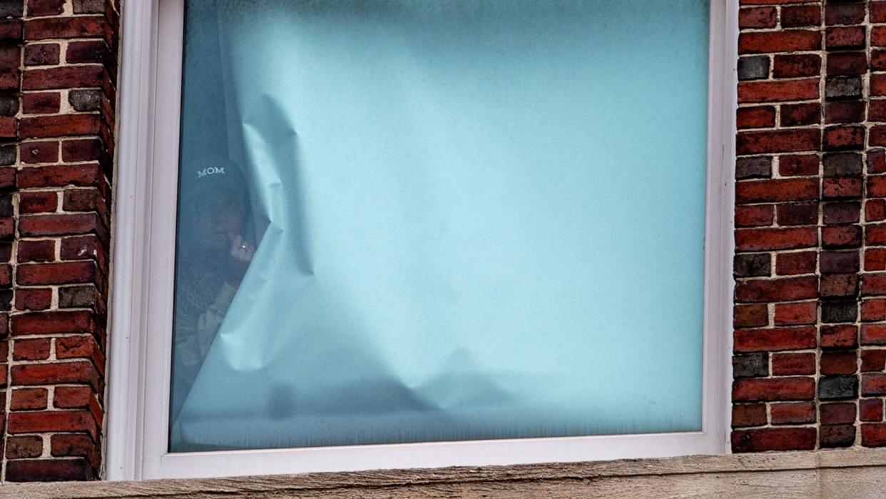 PHOTO: A person looks out of a window at Hamilton Hall in Columbia University, which student protesters barricaded during the ongoing conflict between Israel and the Palestinian Islamist group Hamas, in New York City, Apr. 30, 2024.  (David Dee Delgado/Reuters)