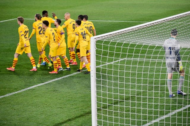 Barcelona players celebrate their win over Osasuna in Pamplona