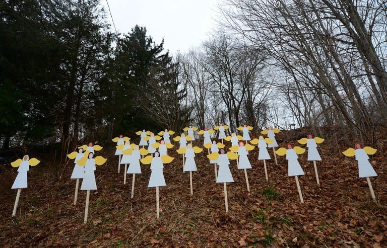 Wooden angel cut-outs in memory to the 26 victims of a school shooting in Newtown, Connecticut, on December 16, 2012