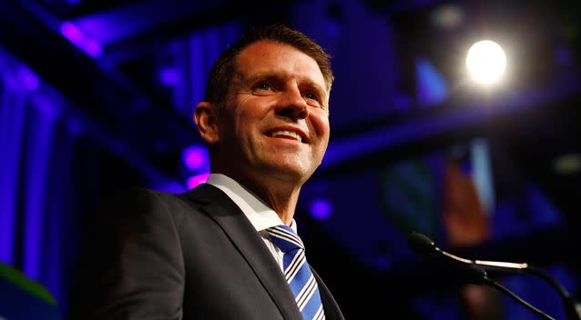 NSW Premier Mike Baird takes the stage after claiming victory in the NSW state election. Photo: AAP