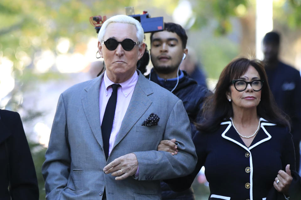 Roger Stone, left, with his wife Nydia Stone, arrives at the federal court in Washington, Tuesday, Nov. 5, 2019. Stone, a longtime Republican provocateur and former confidant of President Donald Trump, goes on trial over charges related to his alleged efforts to exploit the Russian-hacked Hillary Clinton emails for political gain. (AP Photo/Manuel Balce Ceneta)