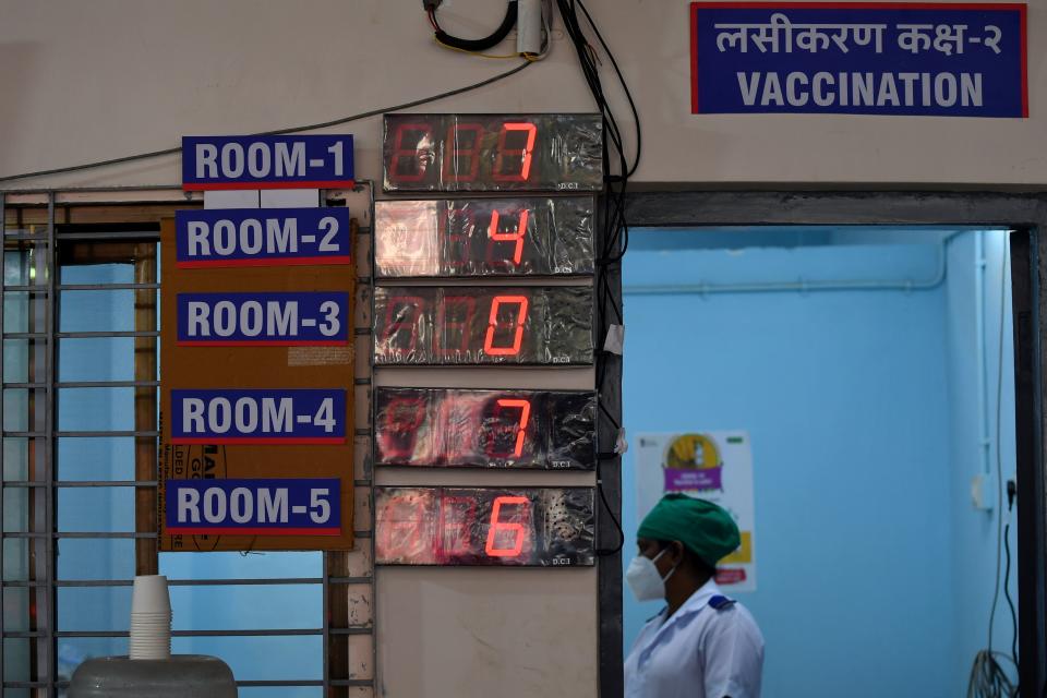 A medical worker stands in a vaccination room while waiting to inoculate colleagues with a Covid-19 coronavirus vaccine at the Rajawadi Hospital in Mumbai on January 16, 2021. (Photo by Indranil MUKHERJEE / AFP) (Photo by INDRANIL MUKHERJEE/AFP via Getty Images)