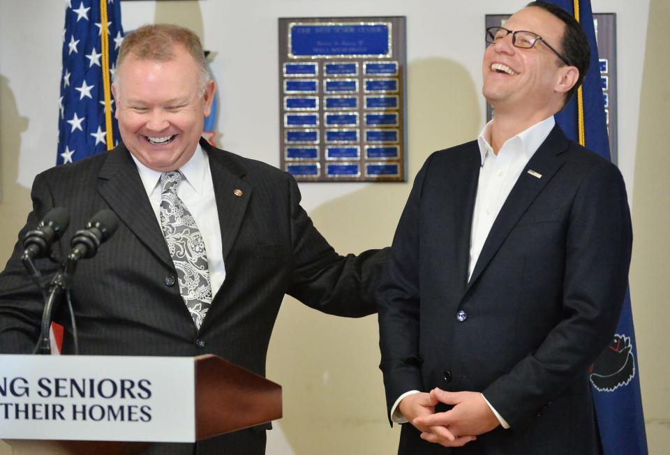 Pennsylvania state representative Pat Harkins, left, jokes with Governor Josh Shapiro during a visit to the Erie West Senior Center.