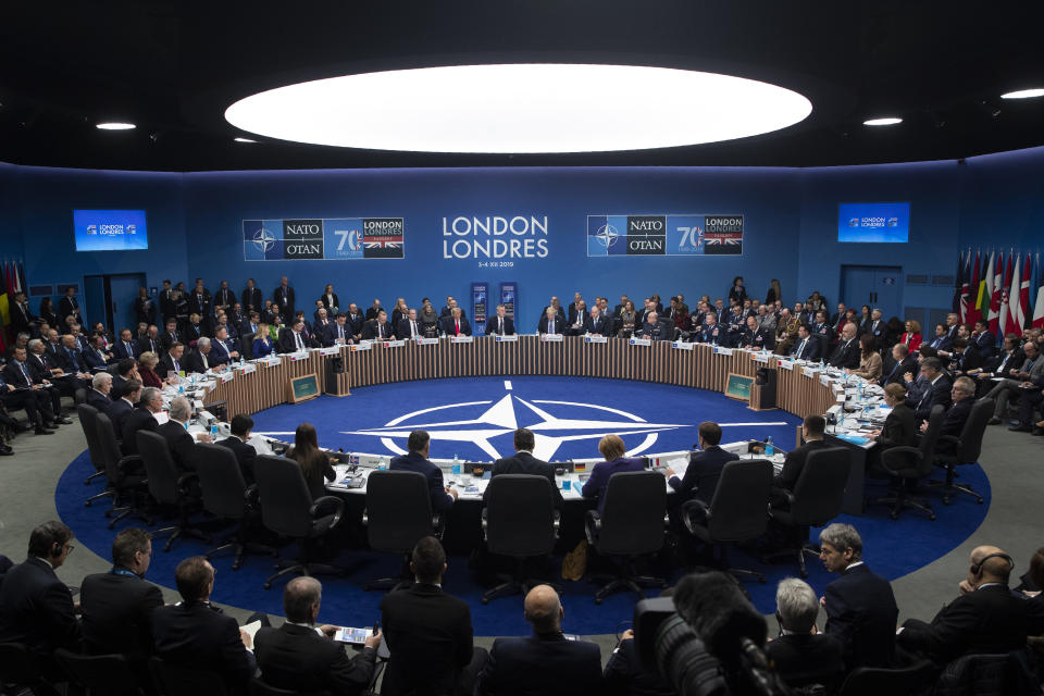 FILE - In this Dec. 4, 2019 file photo, NATO Secretary General Jens Stoltenberg makes an opening statement during a plenary session at the NATO summit at The Grove, in Watford, England. A festering row between France and Turkey over a naval standoff in the Mediterranean Sea has shone a glaring searchlight on NATO's struggle to keep order among its ranks and exposed weaknesses in a military alliance that can only take action by consensus. (AP Photo/ Evan Vucci, File)