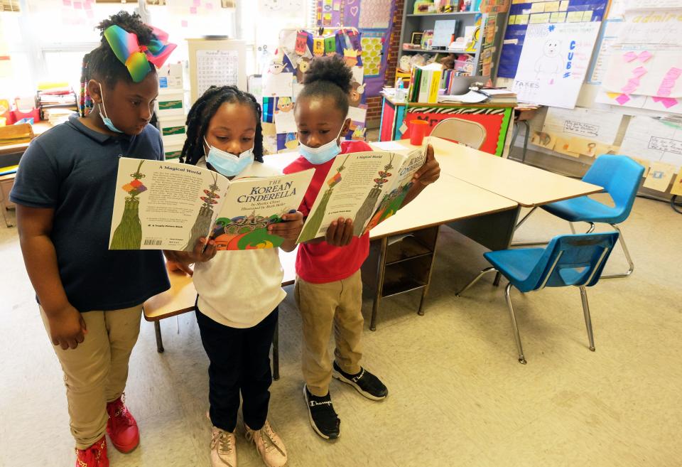 Students read aloud in a class at Baker Elementary School in south Jackson, Miss.