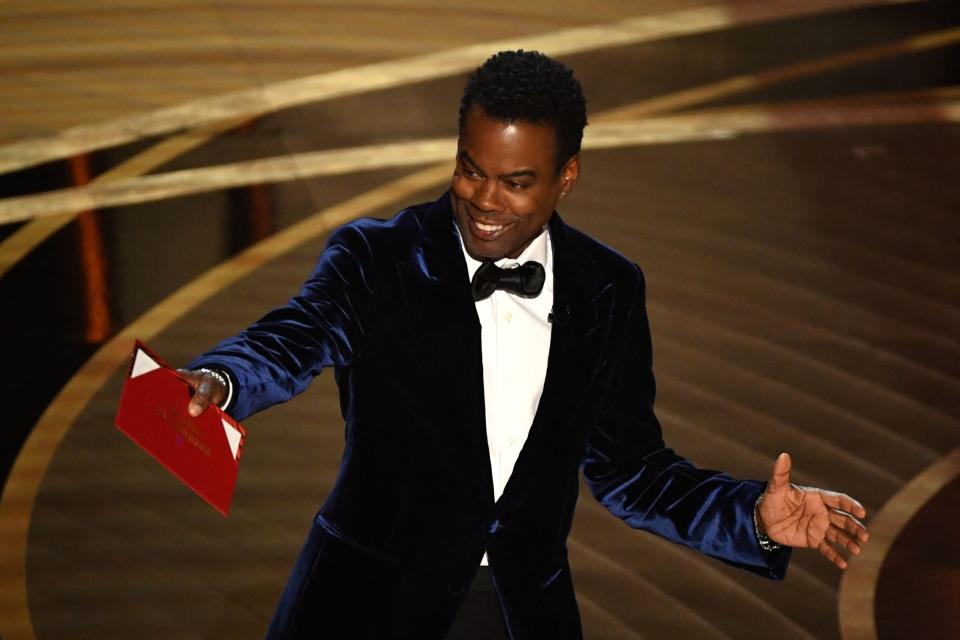 Chris Rock has seen ticket sales for his upcoming world tour surge dramatically following his getting slapped by actor Will Smith at Sunday night's Oscars (Getty Images)