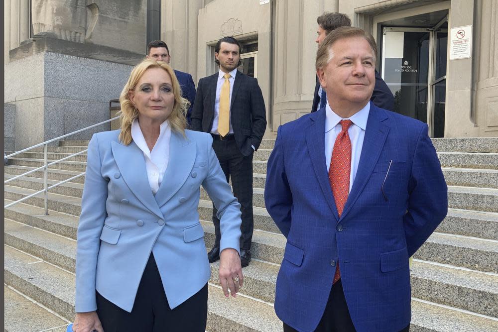 Patricia McCloskey, left, and her husband Mark McCloskey leave a court in St. Louis, Thursday, June 17, 2021. (AP Photo/Jim Salter)