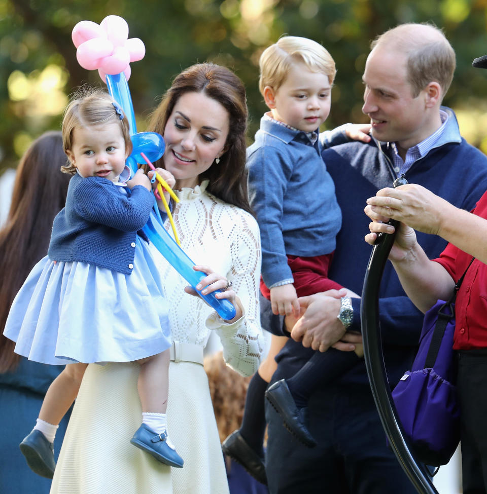 Kate, William, Princess Charlotte and Prince George at a children’s party on the royal tour of Canada in 2016 [Photo: Getty]