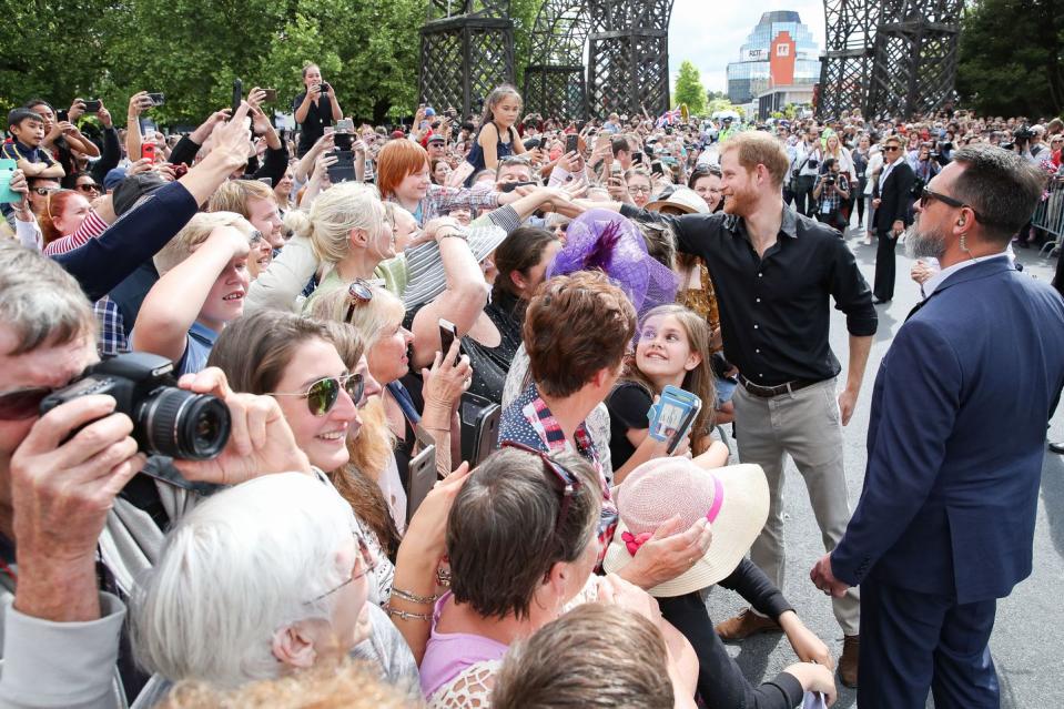 <p>Harry reached across the crowd to greet a fellow ginger in New Zealand, in October of 2018. </p>