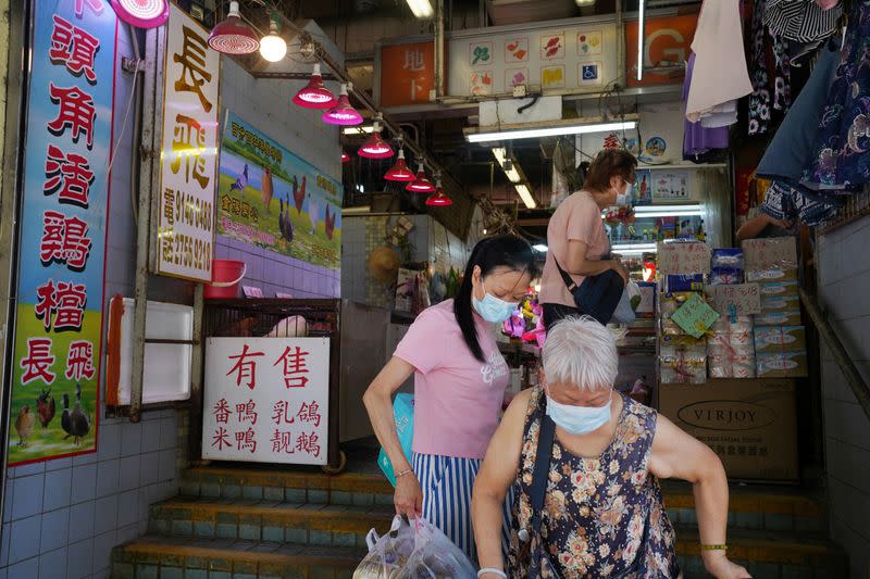 People are seen at a market in Hong Kong