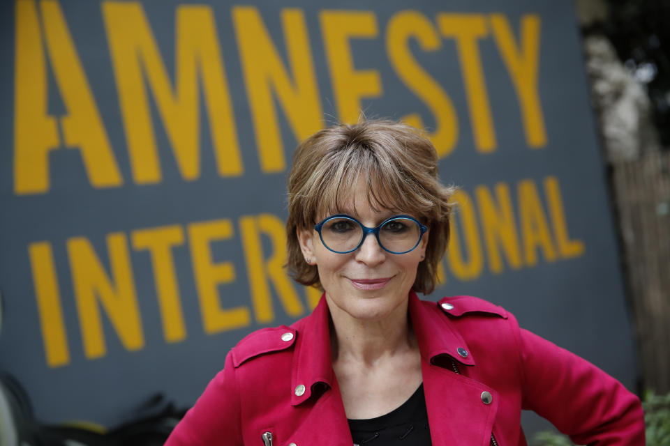 Amnesty International Secretary General Agnes Callamard poses in Paris, Tuesday, April 6, 2021. Agnes Callamard is best known for her investigation into the killing of Saudi journalist Jamal Khashoggi, and has made a career uncovering extra-judicial killings. The French human rights expert's focus on rights abuses is taking on new dimensions as she assumes leadership of Amnesty International and turns her attention to what she says is one of the world's most pressing rights issues — vaccine equity. (AP Photo/Christophe Ena)