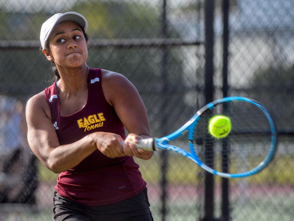 Dunlap top singles player Shikha Agarwal makes a return against Morton opponent Chloe Kendall during their tennis match Tuesday, Sept. 19, 2023 at Dunlap High School.