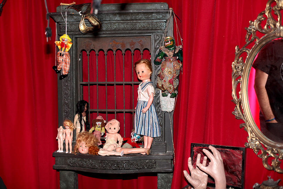 <p><em>Insidious</em> fans will recognize this red room as the demon’s lair from the first movie. The room is covered in frightening dolls and various trinkets matching that of the film’s. (Photo: Camilo Urdaneta/Yahoo) </p>