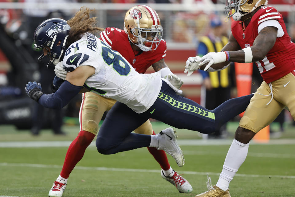 FILE - Seattle Seahawks tight end Colby Parkinson (84) dives toward the end zone to score past San Francisco 49ers cornerback Deommodore Lenoir, rear, during the second half of an NFL football game in Santa Clara, Calif., Sunday, Dec. 10, 2023. The Los Angeles Rams have agreed to contract terms with tight end Colby Parkinson and guard Jonah Jackson, a person with knowledge of the deals said Monday, March 11, 2024. Parkinson got a three-year, $22.5 million deal. (AP Photo/Josie Lepe, File)