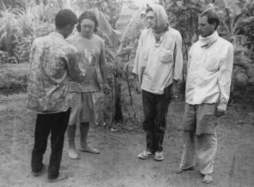 File photo shows (R-L) Briton Mark Slater, Frenchman Jean-Michel Braquet and Australian David Wilson with one of their Khmer Rouge captors in Cambodia's Phnom Vuor on September 2, 1994. The three were snatched from a train ambushed by Khmer Rouge militia between Phnom Penh and Sihanoukville on July 26, 1994