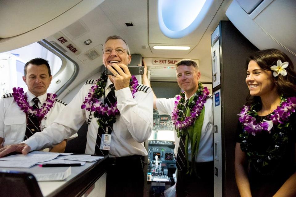 Capt. Michael Styer greets passengers on Southwest Airlines' inaugural Hawaiian flight to Honolulu, Hawaii, from Oakland, Calif., earlier this year.